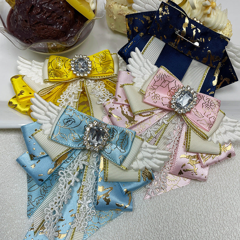 Group of four bow clips — yellow navy blue sky blue and pink