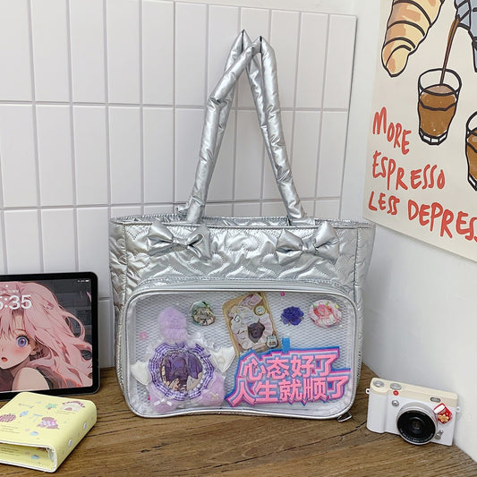 Silver metallic quilted ita tote with badge display