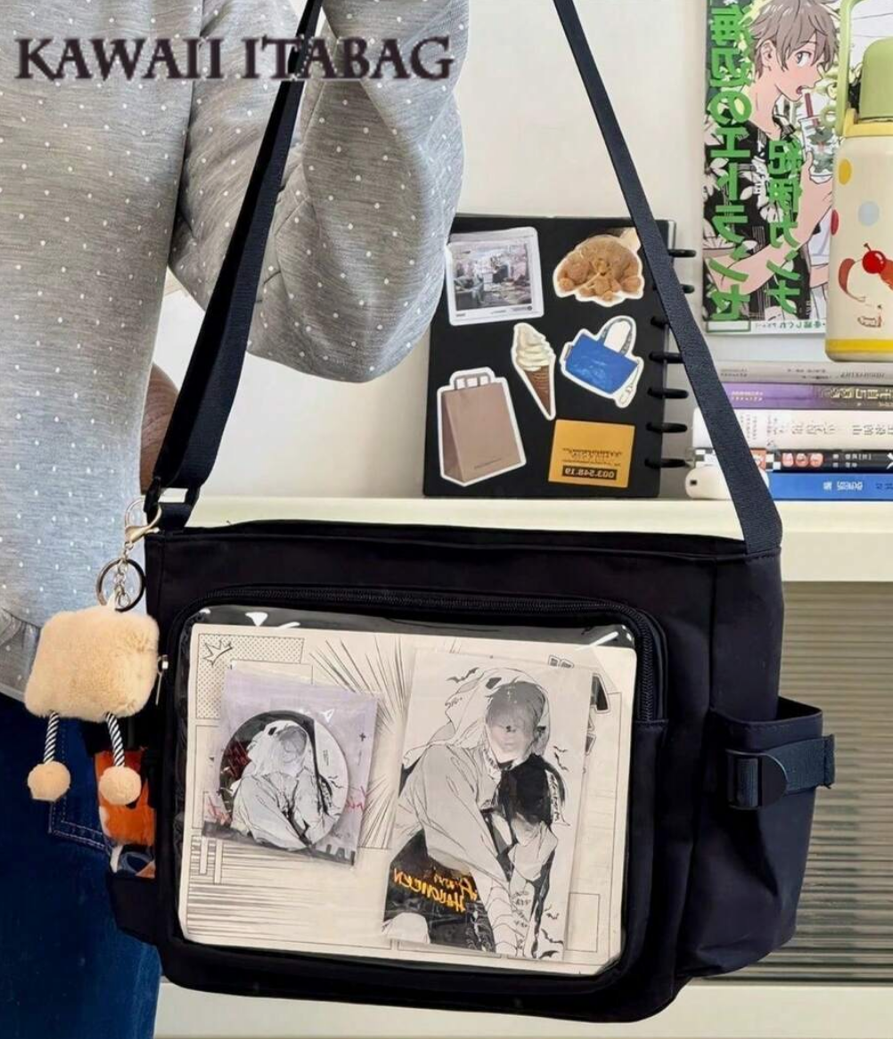 Pink and black Kawaii Ita Messenger Bag with clear window for anime pin display and side pocket for 10cm plush doll.