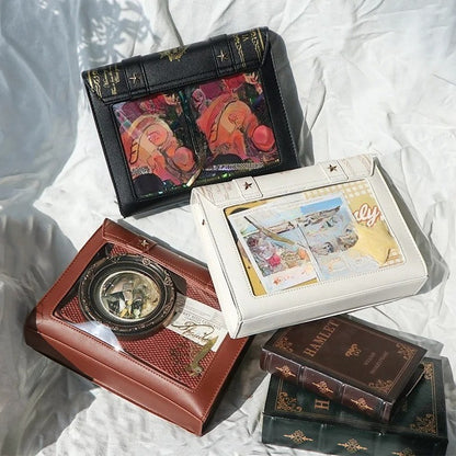 Book-shaped ita bag open showing clear display window
