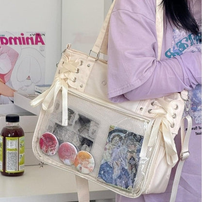 kawaii lace-up ita bag ivory with clear pin display window worn as crossbody harajuku style