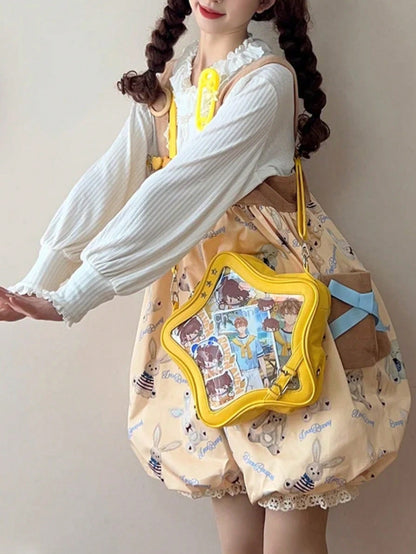 Person wearing yellow star display bag with prints