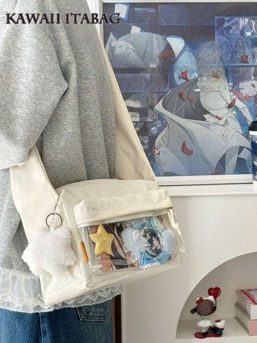 Cream kawaii ita crossbody bag with clear window pocket worn crossbody, filled with anime merch pins and plushies