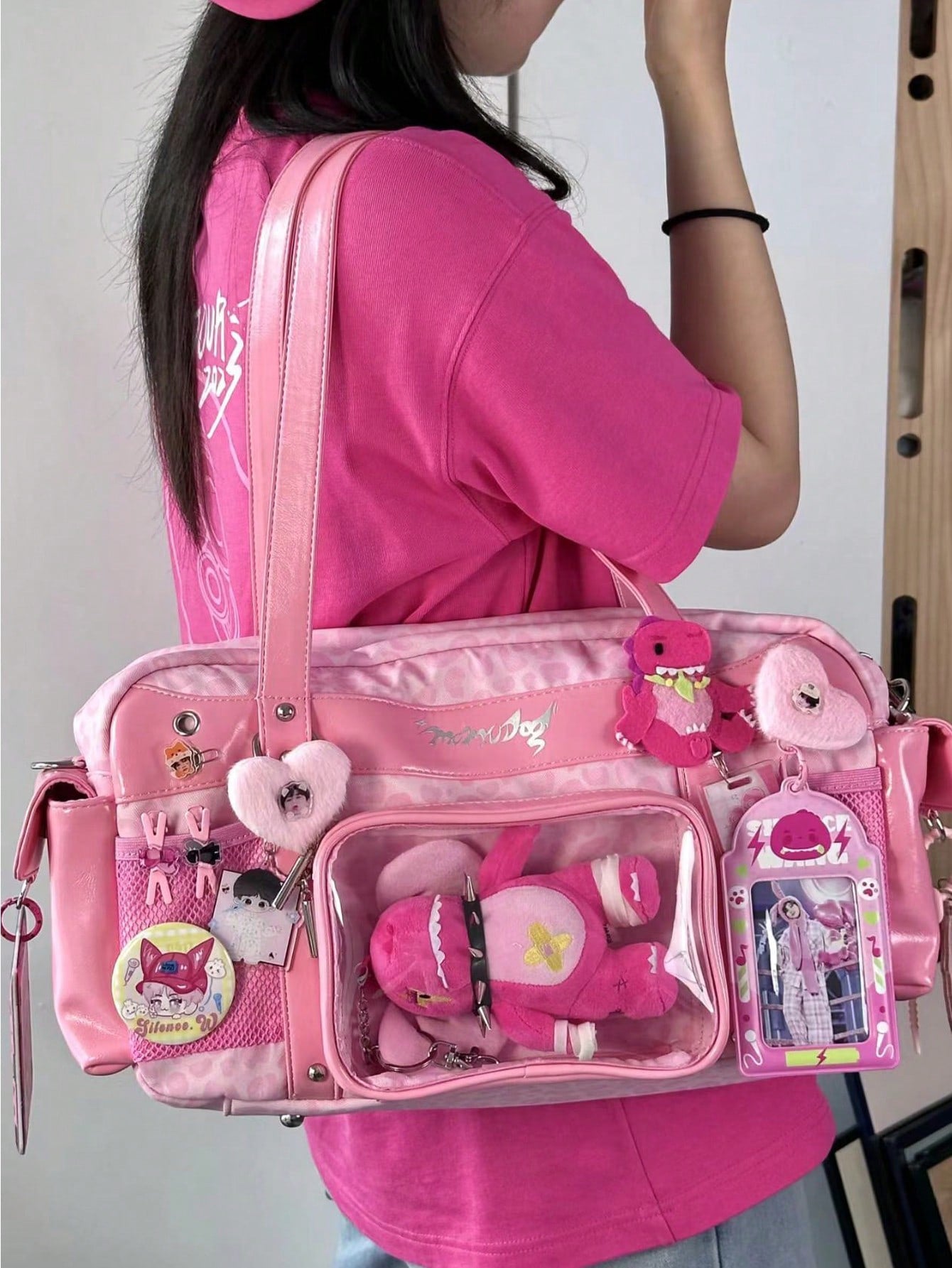 Pink Boston bag with pink dino plush