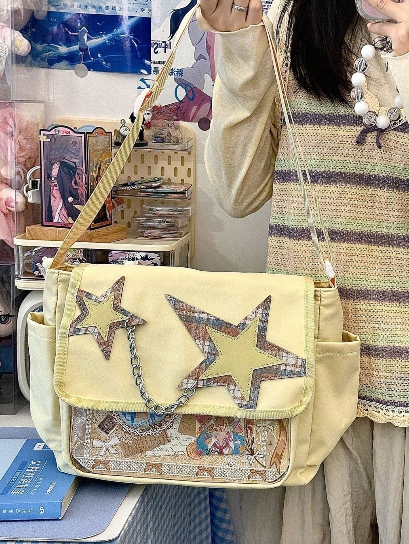 Lemon yellow star ita messenger bag worn front view