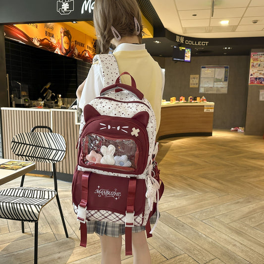 Burgundy ita backpack worn at McDonald's, rear view