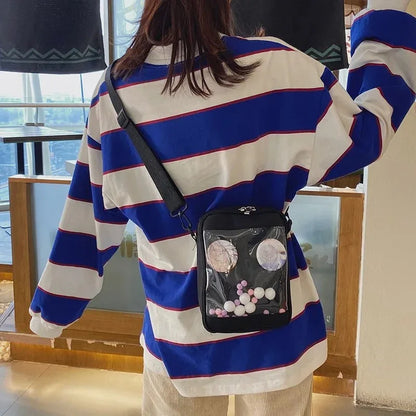 Classic black canvas crossbody ita bag with transparent window and internal mesh pocket for pin display.