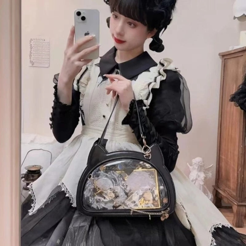 Black cat ita bag worn crossbody with gothic lolita dress