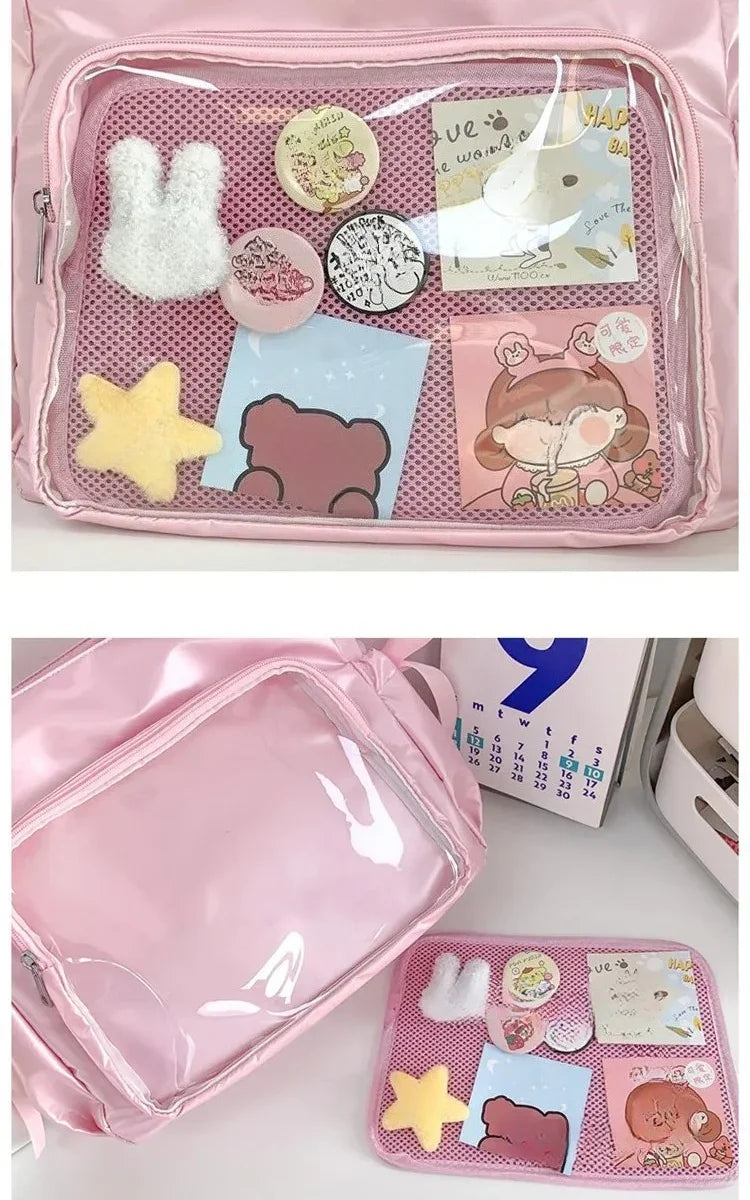 Close-up of the removable pink mesh insert for the ita bag, shown with charms and postcards attached behind the PVC window
