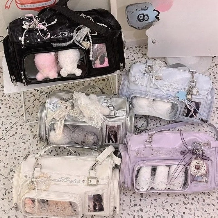 Six colourways of transparent display Boston bags arranged