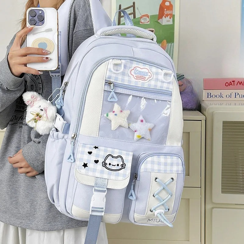 Blue Miusi kawaii ita backpack with star charms worn by model