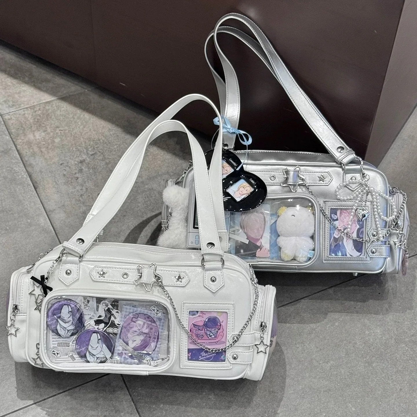 white and silver star ita bag boston tote with detachable display pouch loaded with anime badges and photocards