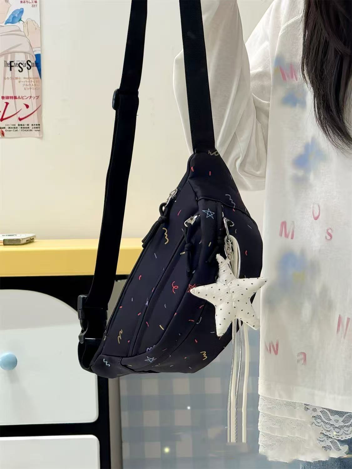 black confetti sling bag worn as crossbody side view