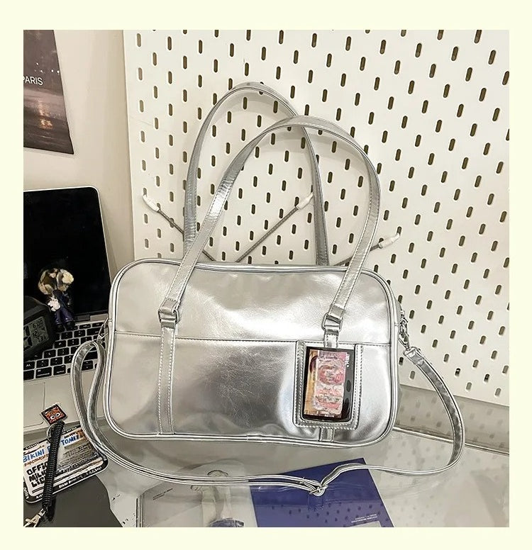 large ita bag back view showing transparent photocard slot on silver metallic exterior
