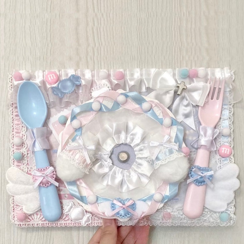 Blue and pink kawaii placemat with M&M accents and cross charm bow detail