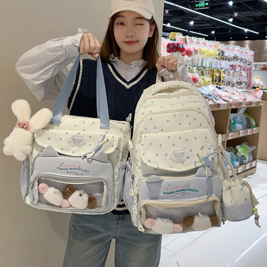 Girl holding 3-piece kawaii star ita bag set in blue