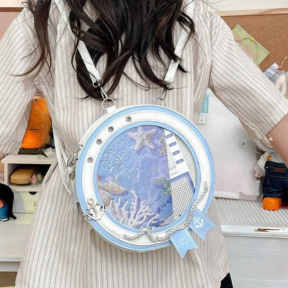 round ita bag white PU leather blue inner frame circular clear display window with anchor charm crossbody