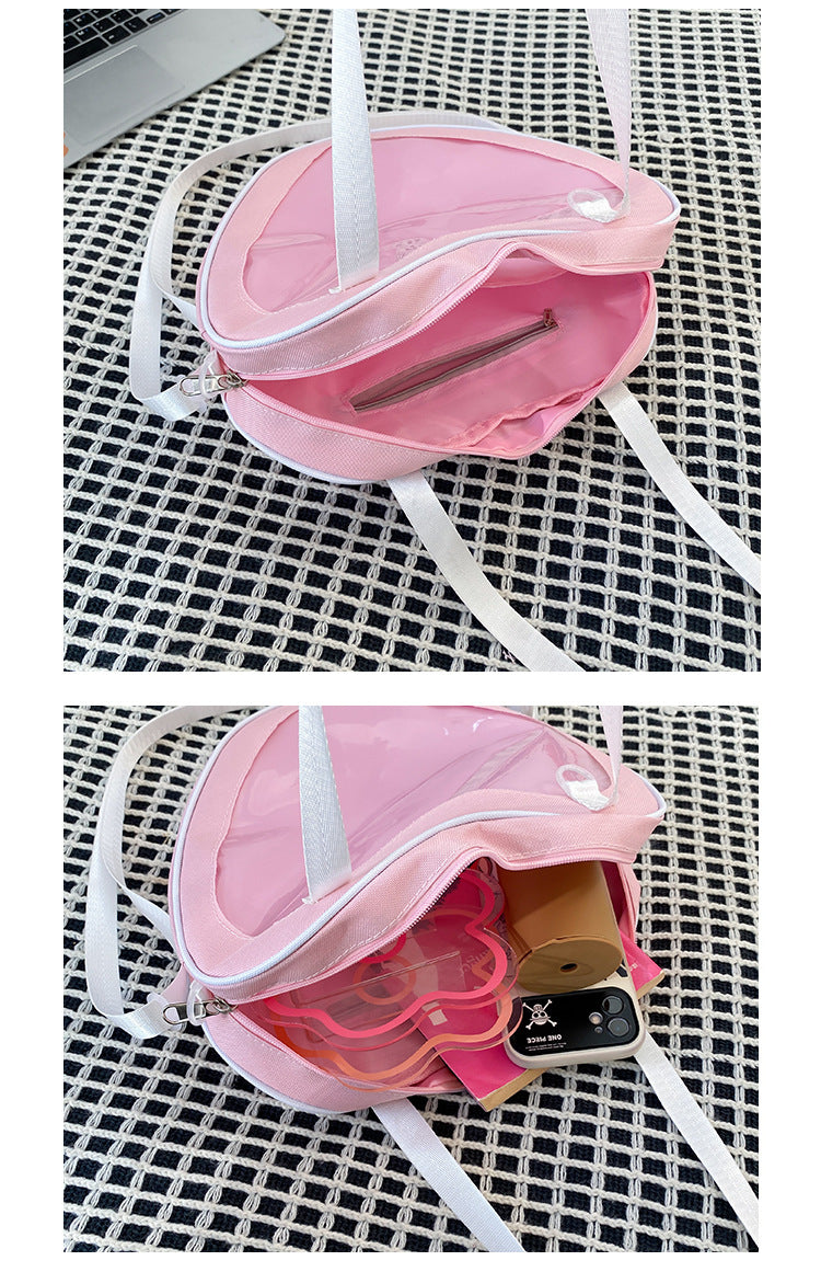 heart ita bag interior showing internal zip pocket and capacity with phone acrylic and accessories