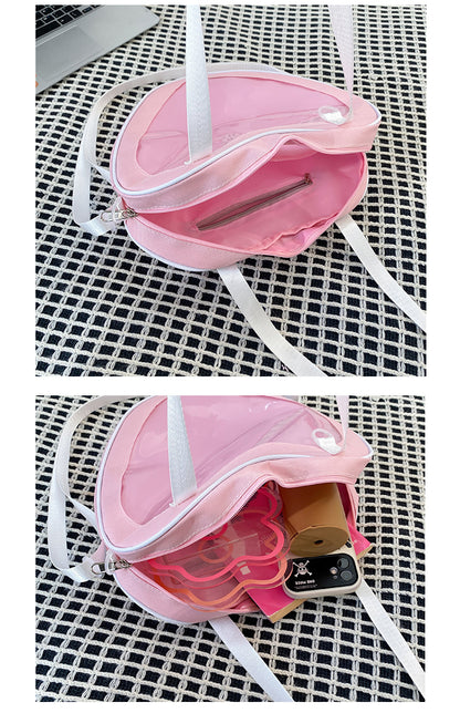 heart ita bag interior showing internal zip pocket and capacity with phone acrylic and accessories