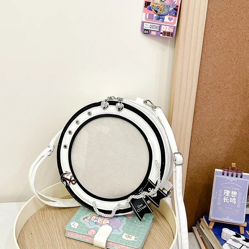 round ita bag white PU leather empty clear circular display window mesh backing anchor charm flat lay