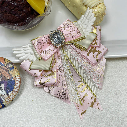 Angel Wing Bow Brooch Hair Clip with Rhinestone Centre, Lace Trim & Gold Foil Ribbon — 6 Colours