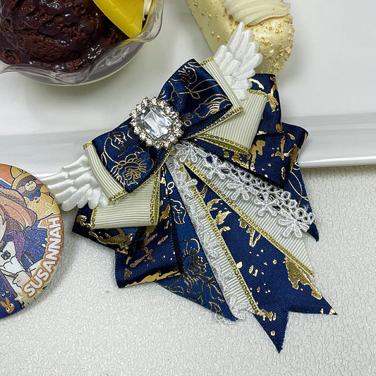 Navy blue angel wing bow clip with crystal gem and lace tails