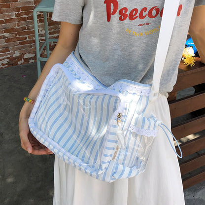 Blue stripe ita shoulder bag held showing clear window and lace