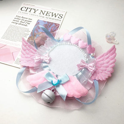 Pink blue angel wing badge holder frame on newspaper background