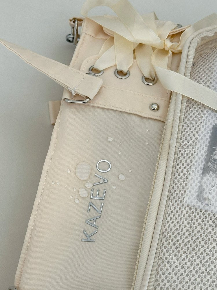 lace-up ita bag water-resistant nylon side detail with ribbon lacing and silver grommets