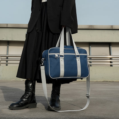 blue grey japanese jk school bag hand carry side view silver rivet detail and d-ring clip