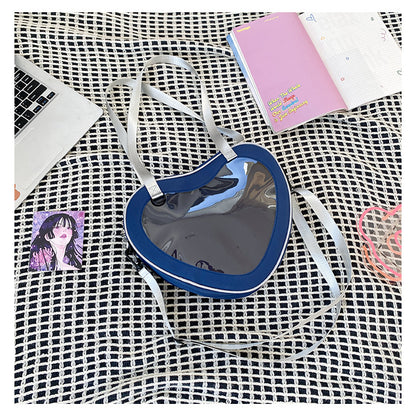 navy blue heart shaped ita bag clear window nylon crossbody worn over shoulder