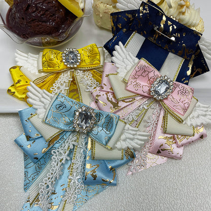 Group of four bow clips — yellow navy blue sky blue and pink