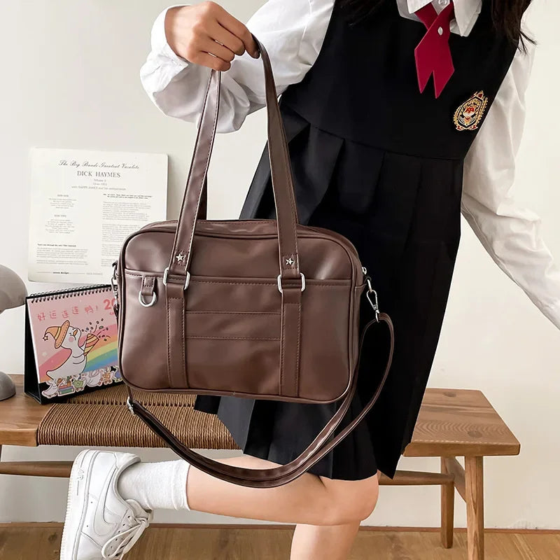 Japanese preppy JK school bag brown PU leather handheld carry with star rivets front view
