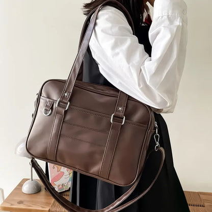 JK uniform bag brown PU leather shoulder carry with star rivets and D-ring hardware side view