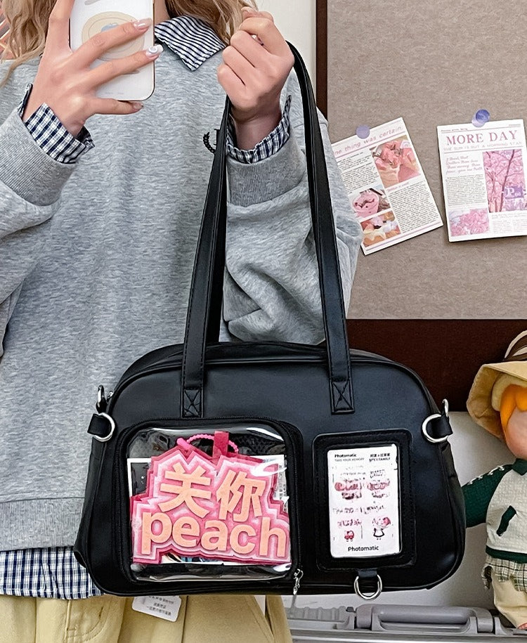 black kawaii ita bag dual window showing acrylic standee and photocard in separate display slots