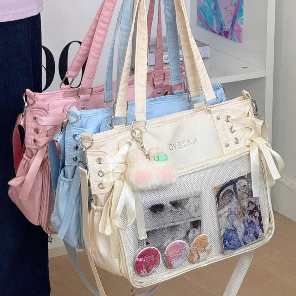ita bag in ivory pink and blue lace-up tote with ribbon bows and clear display window