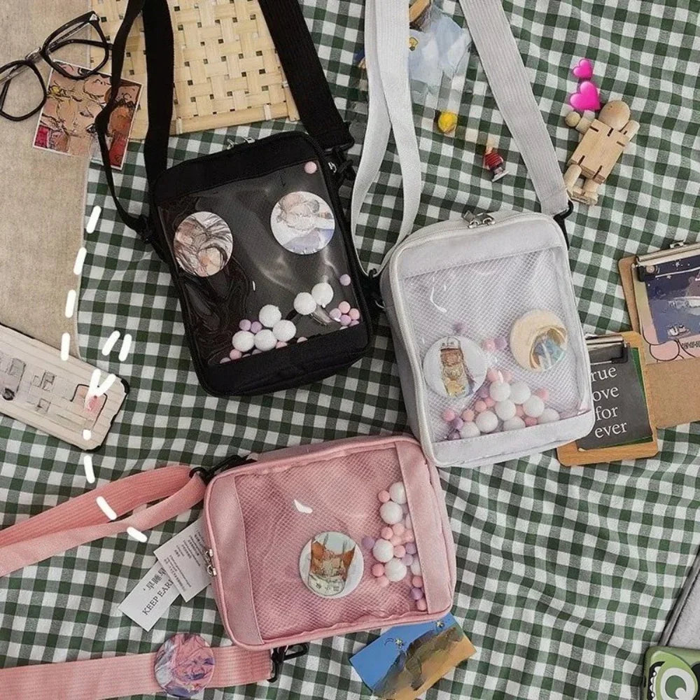 Sunshine yellow canvas ita bag with a clear flap window showing colorful hairballs and a small white plushie