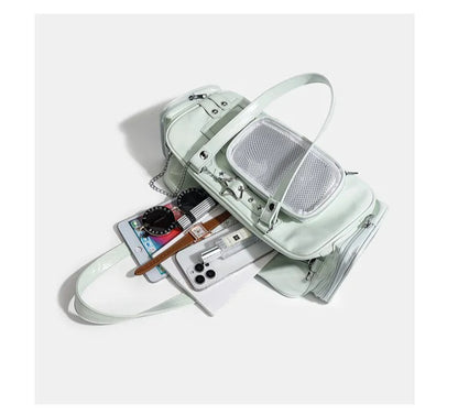 large star ita bag capacity showing two phones tablet watch and accessories fitting inside