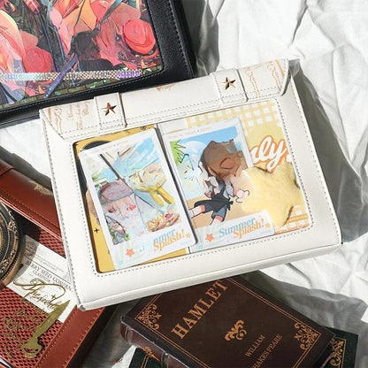 Trading cards displayed in transparent window of book bag

